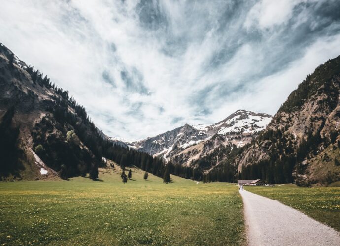 A scenic view of mountains and a road